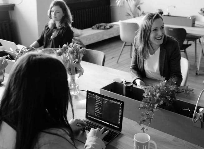 Three people working together